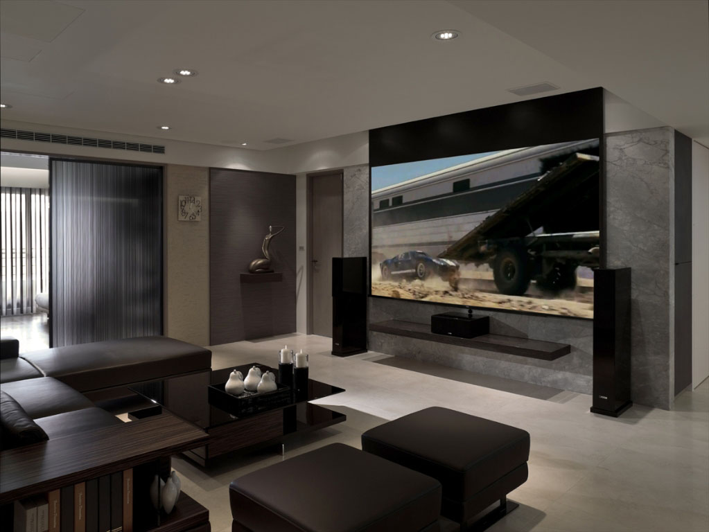 电视主墙以雪花白大理石与平面电视铺陈高品味与机能，并搭配下降式萤幕与投影机来提升影音享乐。
