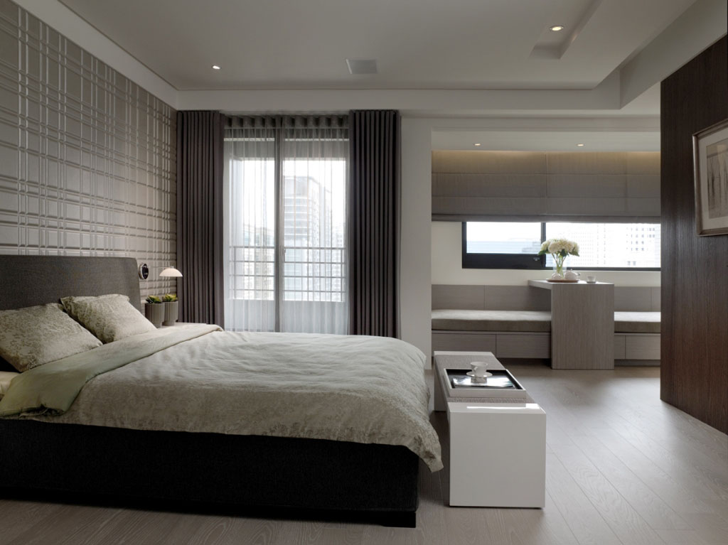 床头壁面以规则的线条切割设计来展显温雅的精品质感。