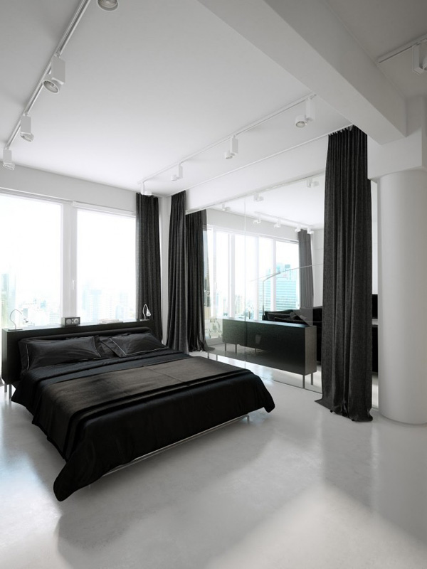 卧室和客厅的隔断采用玻璃隔断，增加视觉上的空间，让睡眠空间更宽敞。黑色的窗帘可以起到实质上的隔断作用。