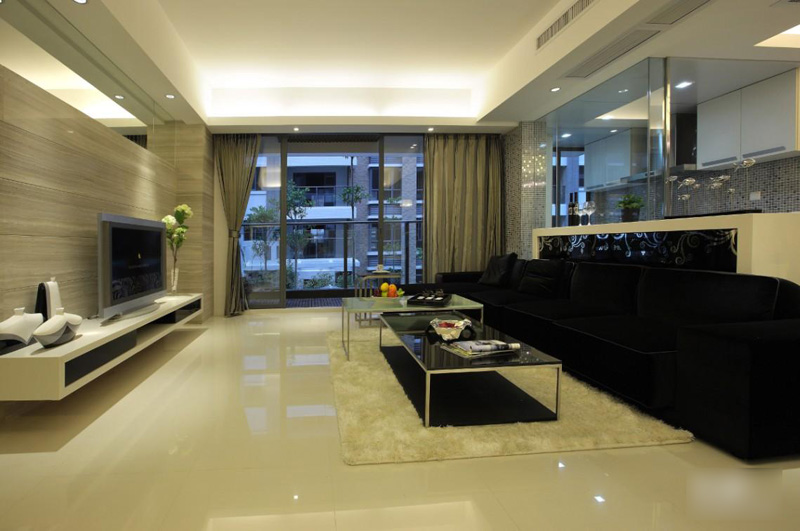 客厅选用黑色沙发和白色的家居形成视觉上鲜明的对比。